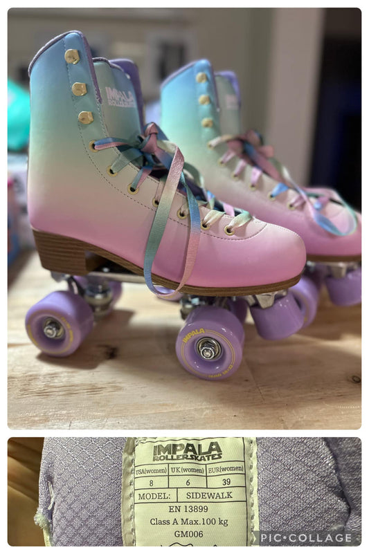 A pair of women's roller skates with a rainbow color scheme, including pink, blue, and green, with the brand 'DS' visible on the frame.