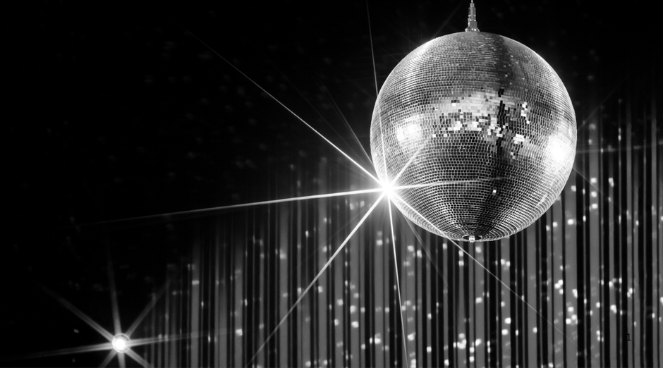 Discoball with reflective surface against a dark background