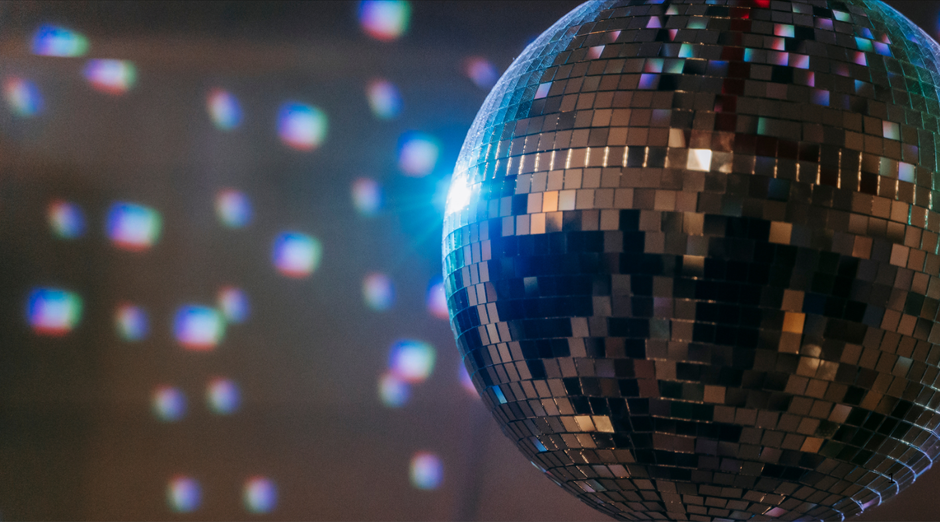  disco ball with colorful lights in the background